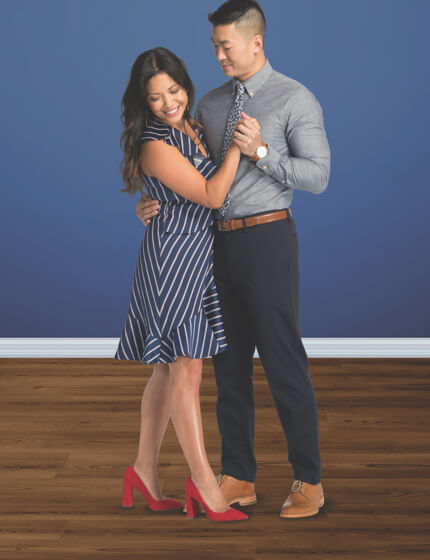 Couple dancing on coretec vinyl flooring | Gillenwater Flooring