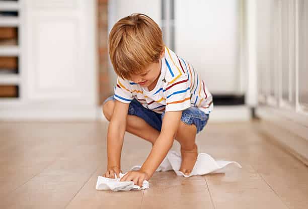 Kid cleaning floor | Gillenwater Flooring