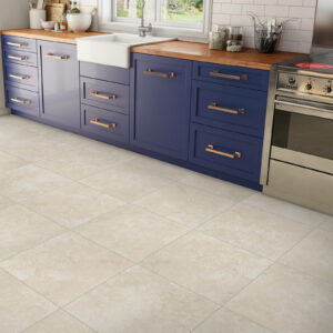 Kitchen tile flooring with blue cabinets | Gillen Water Flooring